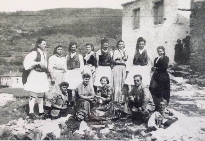 Members of the Greek community of Bangor, Maine visiting their ancestral village of Vamvakou, Greece in 1949, including Nikos Niarchos, a member of the Niarchos shipping family, on the left. Credit: Public Domain